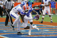 Florida tight end Kyle Pitts (84) catches a pass in front of Kentucky defensive back Brandin Echols for a 2-yard touchdown on a pass play during the second half of an NCAA college football game, Saturday, Nov. 28, 2020, in Gainesville, Fla. (AP Photo/John Raoux)