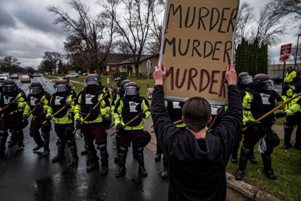 <p>Police in Minnesota have been accused of physically attacking reporters as they cover the Daunte Wright protests</p> (AP)