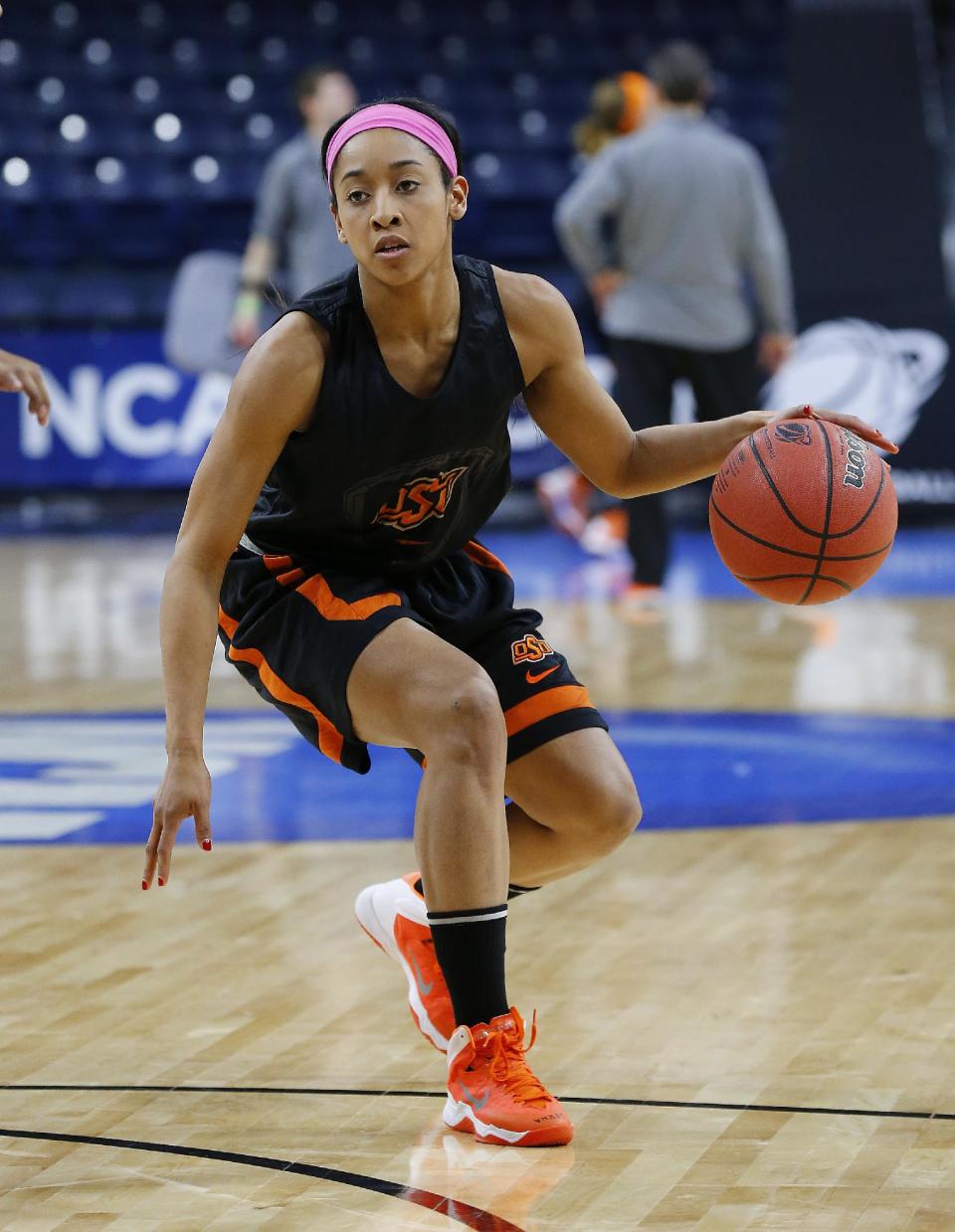 Oklahoma State guard Tiffany Bias dribbles during an NCAA women's college basketball tournament practice at the Purcell Pavilion in South Bend, Ind., Friday, March 28, 2014. Oklahoma State plays Notre Dame on Saturday. (AP Photo/Paul Sancya)