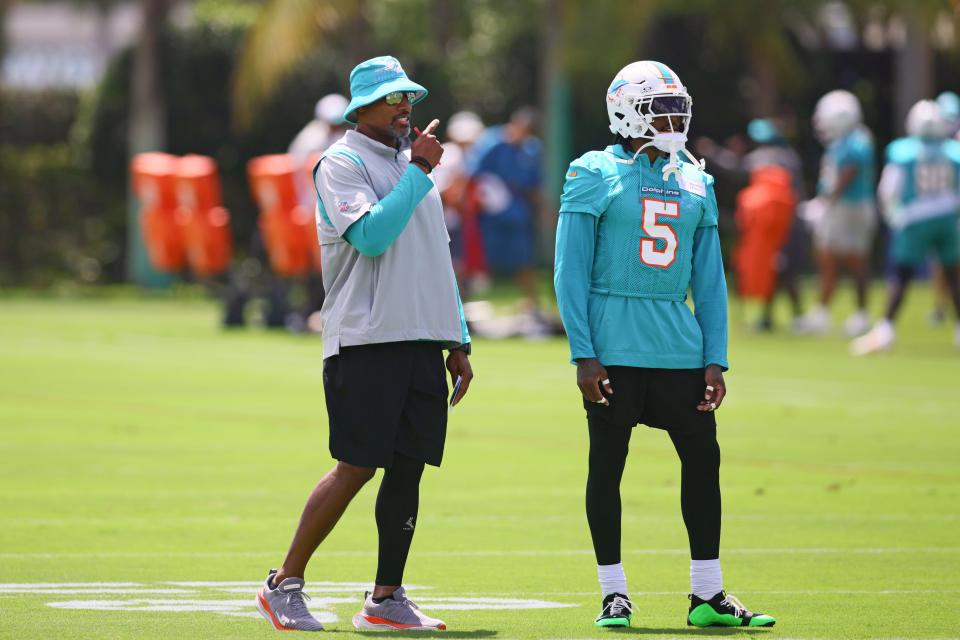 Jun 4, 2024; Miami Gardens, FL, USA; Miami Dolphins defensive coordinator Anthony Weaver talks to cornerback Jalen Ramsey (5) during mandatory minicamp at Baptist Health Training Complex. Mandatory Credit: Sam Navarro-USA TODAY Sports