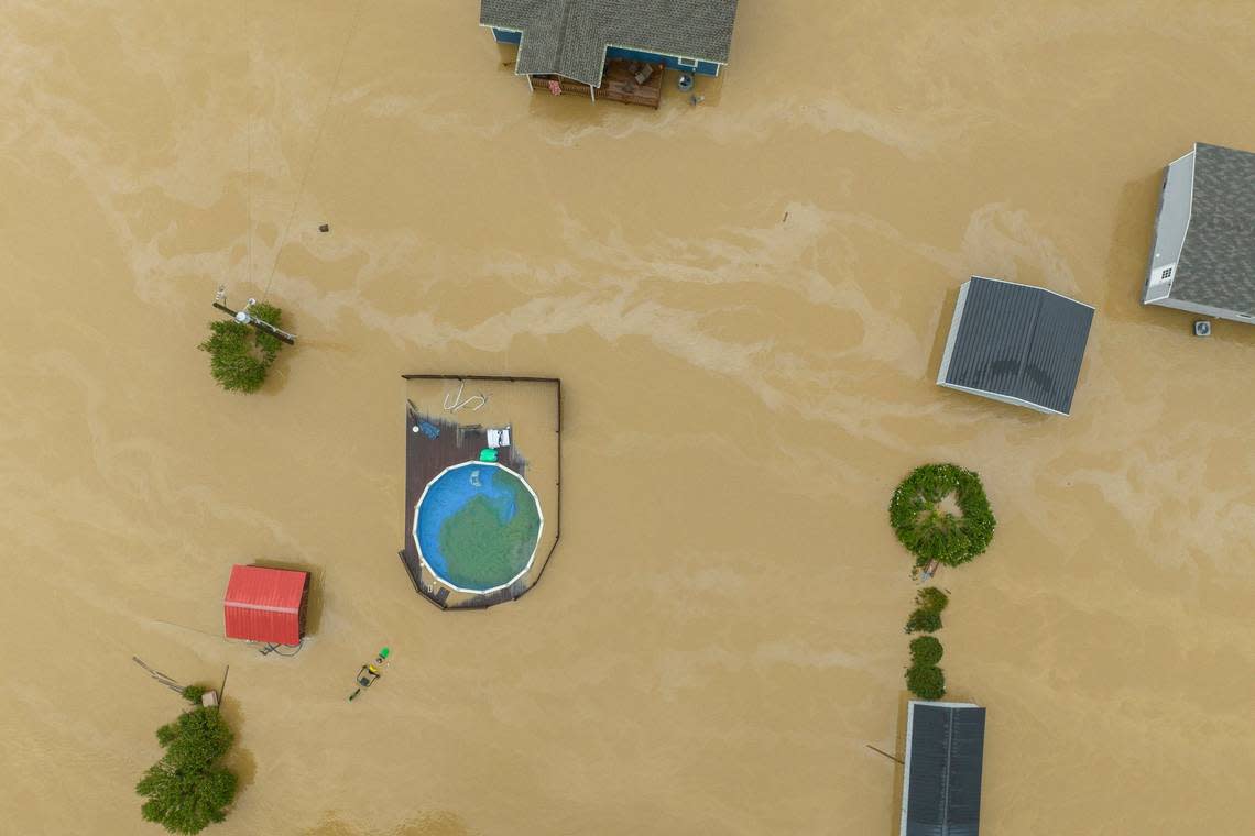 Home and structures are flooded near Quicksand, Ky., Thursday, July 28, 2022.