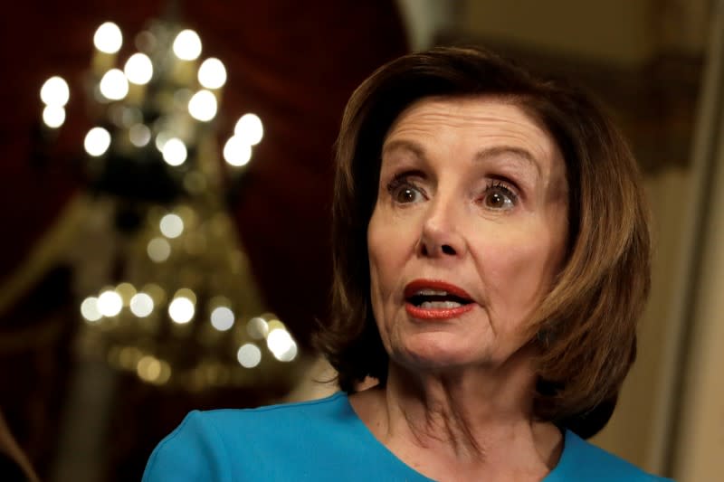 FILE PHOTO: House Speaker Nancy Pelosi (D-CA) speaks to the media about a coronavirus economic aid package on Capitol Hill in Washington