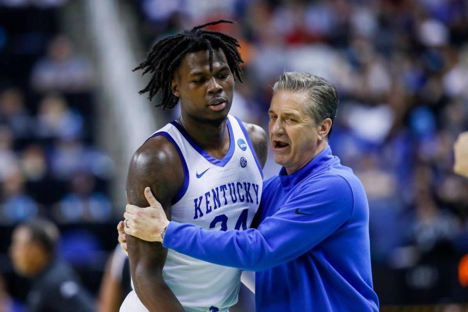 Kentucky head coach John Calipari hugs Wildcats forward Chris Livingston as he comes off the court during the team’s NCAA Tournament game against Providence on Friday night.