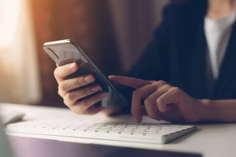 Woman using smartphone. The concept of using the phone is essential in everyday life.