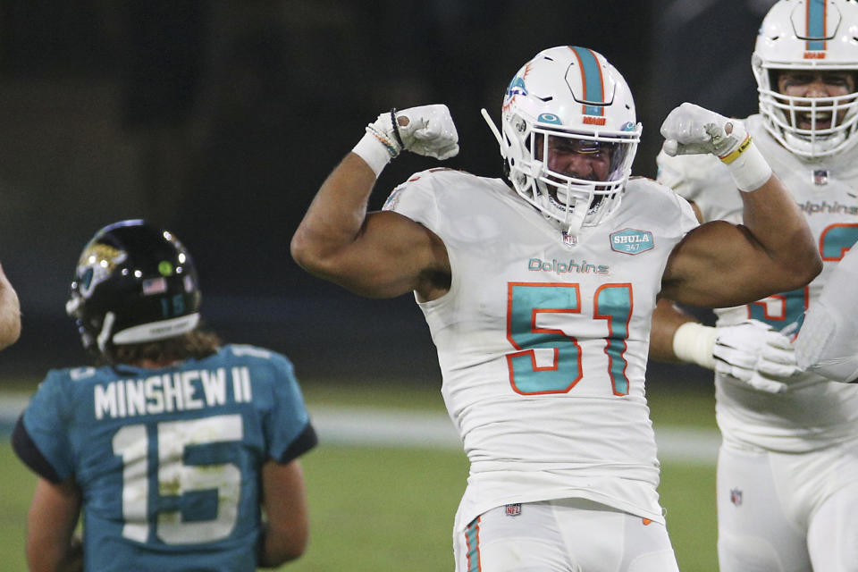 Miami Dolphins outside linebacker Kamu Grugier-Hill (51) celebrates after sacking Jacksonville Jaguars quarterback Gardner Minshew (15) during the first half of an NFL football game, Thursday, Sept. 24, 2020, in Jacksonville, Fla. (AP Photo/Stephen B. Morton)