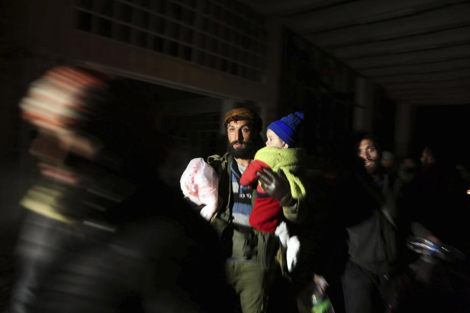 Syrians evacuated from the embattled Syrian city of Aleppo during the ceasefire arrive at a refugee camp in Rashidin, near Idlib, Syria, early Monday, Dec. 19, 2016. The Security Council on Monday approved the deployment of U.N. monitors to the Syrian city of Aleppo as the evacuation of fighters and civilians from the last remaining opposition stronghold resumed after days of delays. (AP Photo)