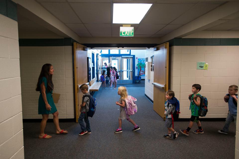 Kindergartners walk to their classroom at Cache La Poudre Elementary School in Laporte in this file photo.