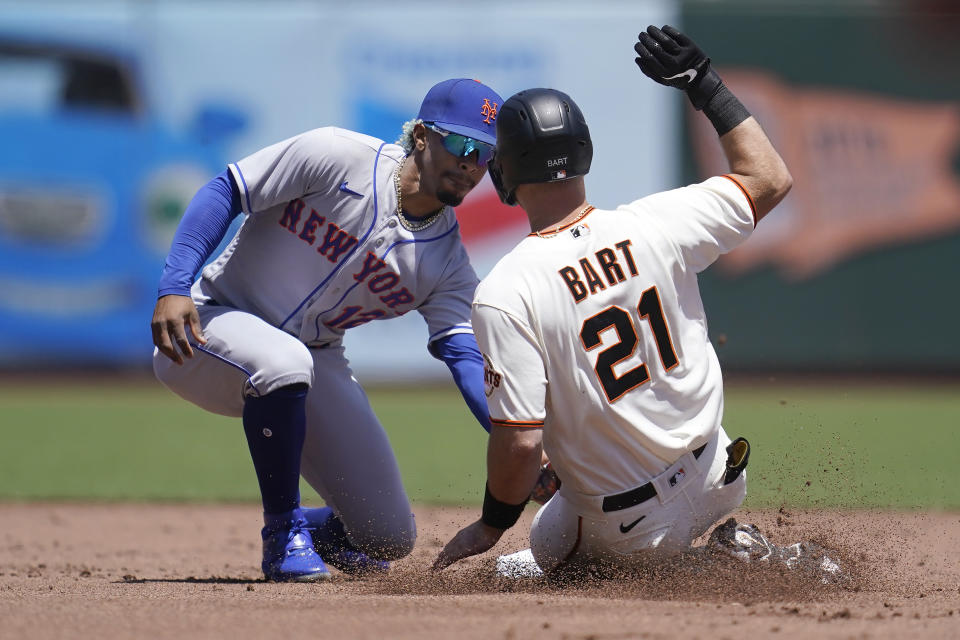 New York Mets shortstop Francisco Lindor, left, tags out San Francisco Giants' Joey Bart trying to steal second base during the first inning of a baseball game in San Francisco, Wednesday, May 25, 2022. (AP Photo/Jeff Chiu)