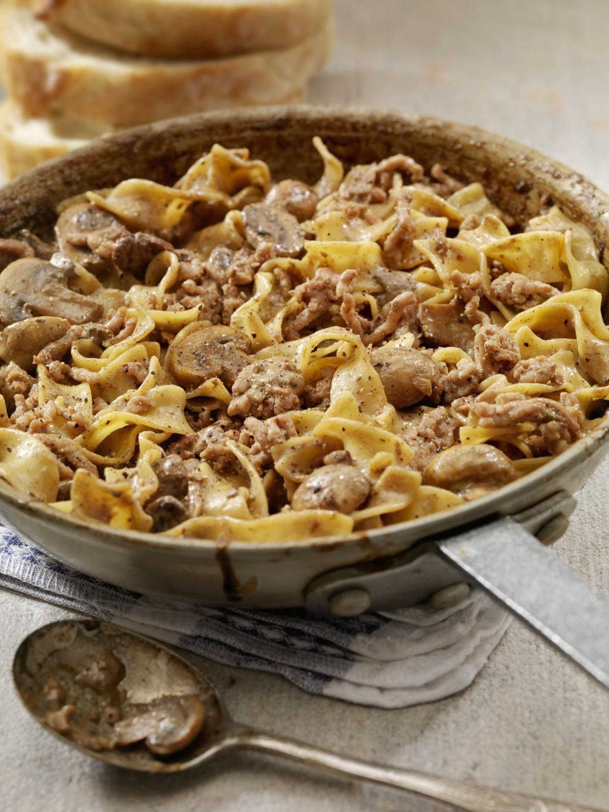 Beef Stroganoff with Ground Beef and Egg Noodles in a Skillet with a side of French Bread- Photographed on Hasselblad H3D2-39mb Camera