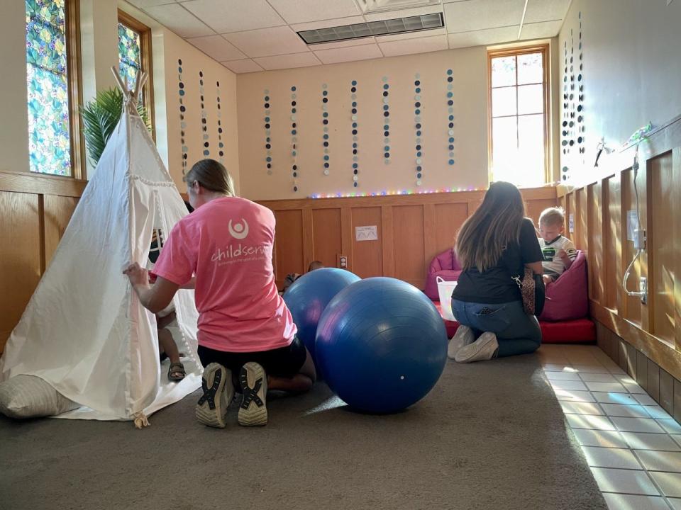 Occupational therapists with ChildServe help entertain kids in the calming room at the Iowa State Fair on Aug. 17.