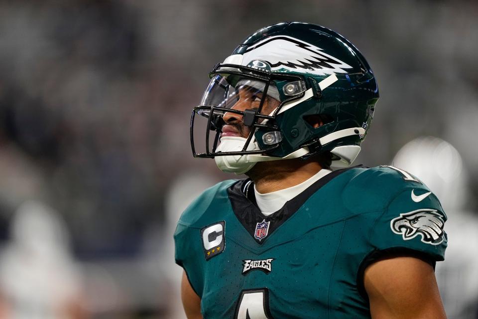 Philadelphia Eagles quarterback Jalen Hurts looks on after teammate DeVonta Smith lost a fumble to the Dallas Cowboys during the second half Sunday, Dec. 10, 2023, in Arlington, Texas.