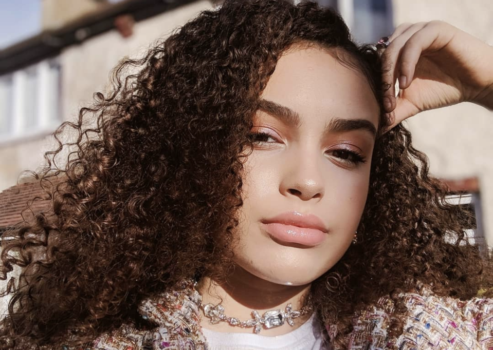 Mya-Lecia Naylor pictured with frizzy hair in a close up photo.