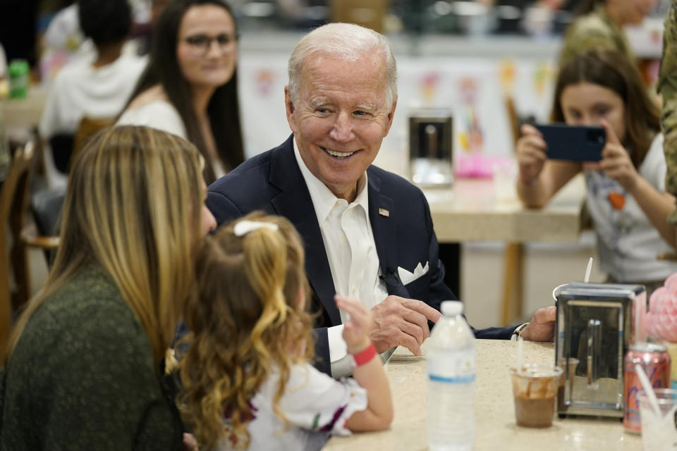 U.S. President Joe Biden, center, meets with American service members and their family at Osan Air Base, Sunday, May 22, 2022, in Pyeongtaek, South Korea. (AP Photo/Evan Vucci)