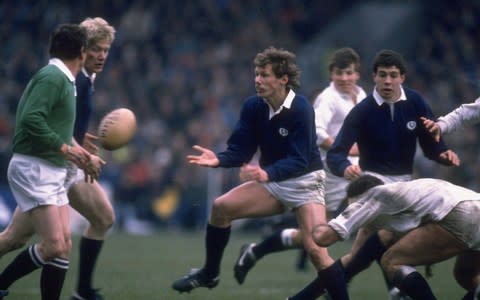 John Jeffrey (left) of Scotland receives the ball from his team mate John Rutherford (centre) during the Five Nations Championship match against England at Murrayfield in Edinburgh, Scotland. Scotland won the match 33-6 - Credit: Allsport