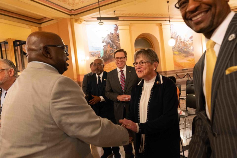 Gov. Laura Kelly shakes hands with participants at Monday's Juneteenth proclamation signing event at the Kansas Statehouse.