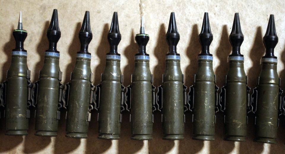 U.S. Army 25 mm rounds of depleted uranium ammunition, photographed Feb. 11, 2004, in Tikrit, Iraq. <a href="https://www.gettyimages.com/detail/news-photo/row-of-us-army-25mm-rounds-of-depleted-uranium-ammunition-news-photo/2973518" rel="nofollow noopener" target="_blank" data-ylk="slk:Stan Honda/AFP via Getty Images;elm:context_link;itc:0;sec:content-canvas" class="link ">Stan Honda/AFP via Getty Images</a>