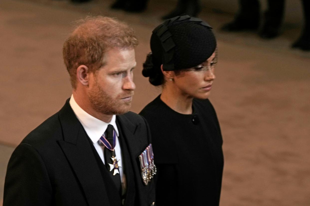 Prince Harry and Duchess Meghan of Sussex leave Westminster Hall on Sept. 14, 2022 in London, during the funeral ceremonies for Queen Elizabeth II.