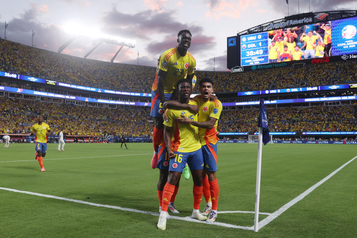 Jefferson Lerma (center) celebrates with teammates after scoring Colombia's lone goal. (Tim Nwachukwu/Getty Images)
