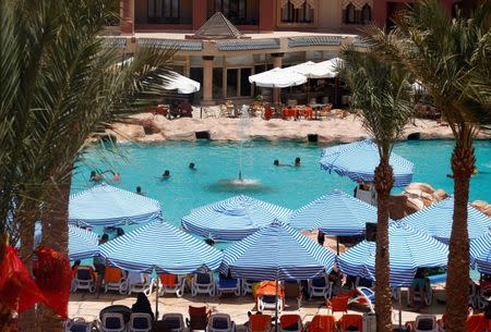 Tourists are seen at a pool, at the Sunny Days El Palacio resort, where a knife attack took place, in Hurghada, Egypt July 16, 2017. REUTERS/Mohamed Abd El Ghany