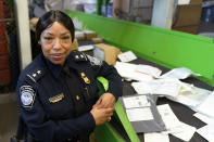 LaFonda D, Sutton-Burke, U.S. Customs and Border Protection Director of Field Operations poses for a portrait at the agency's overseas mail inspection facility at Chicago's O'Hare International Airport Feb. 23, 2024, in Chicago. The explosive growth of cross-border e-commerce involving major China-backed players such as Shein and Temu has caught the attention of the U.S. lawmakers amid a bitter U.S.-China trade war and cast a spotlight on a tax rule that critics say has allowed hundreds of millions of China-originated packages to enter the U.S. market each year without duty and without reliable information for lawfulness. (AP Photo/Charles Rex Arbogast)