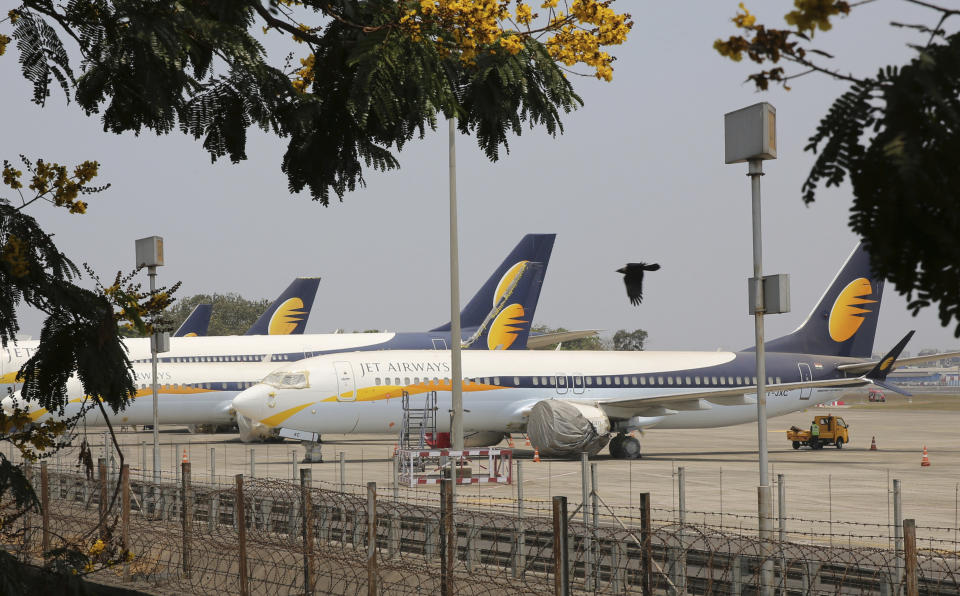 Jet Airways aircrafts are seen parked at Chhatrapati Shivaji Maharaj International Airport in Mumbai, Monday, April 15, 2019. India's ailing Jet Airways has drastically reduced operations amid talks with investors to purchase a controlling stake in the airline and help it reduce its mounting debt. (AP Photo/Rafiq Maqbool)