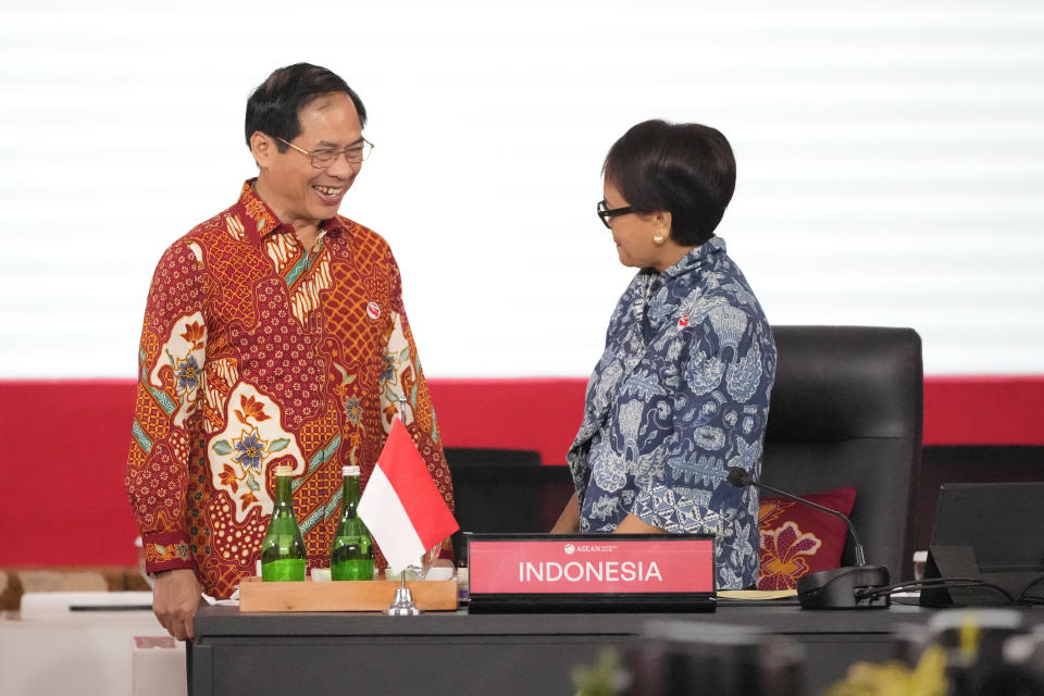 Vietnam's Foreign Minister Bui Thanh Son, left, talks to Indonesian Foreign Minister Retno Marsudi, right, during the Association of Southeast Asian Nations (ASEAN) foreign ministers retreat in Jakarta, Indonesia, Saturday, Feb. 4, 2023. (AP Photo/Achmad Ibrahim)