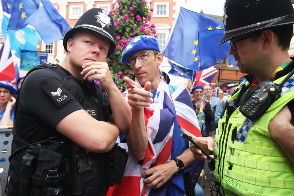 A protester speaks to police officers in York during a demonstration against Prime Minister Boris Johnson's decision to suspend Parliament for up to five weeks before a Queen's Speech on October 14. (Photo by Danny Lawson/PA Images via Getty Images)