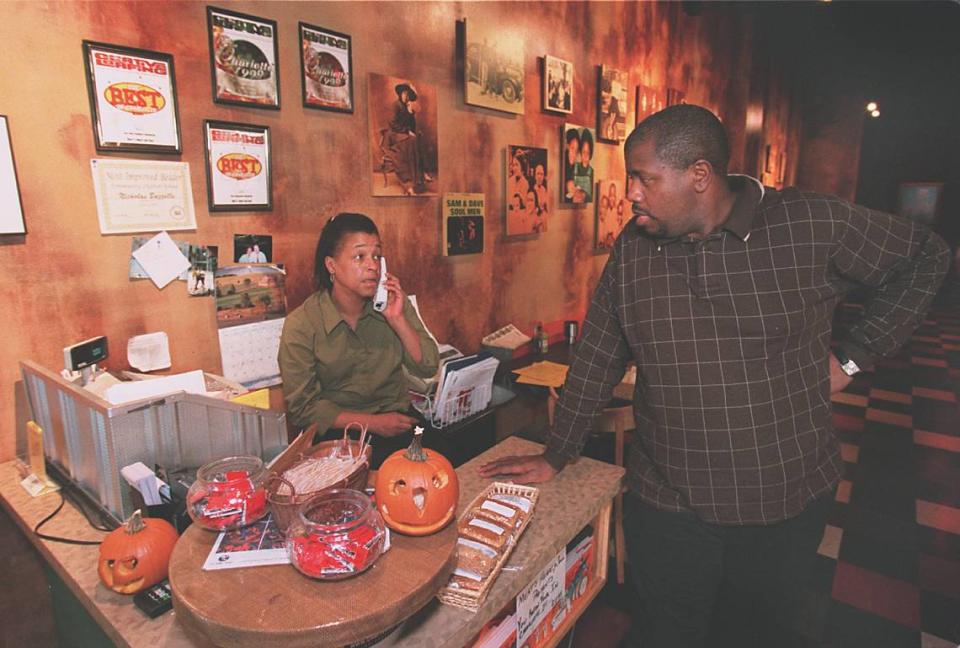 Renee Cooper-Bazzelle and her husband James Bazzelle talk between waiting on customers at Mert’s Heart and Soul Restaurant in October 2000.