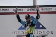 Kevin Harvick celebrates after winning a NASCAR Cup Series auto race at Atlanta Motor Speedway, Sunday, June 7, 2020, in Hampton, Ga. (AP Photo/Brynn Anderson)