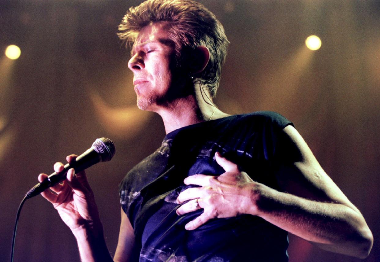 David Bowie performs on stage