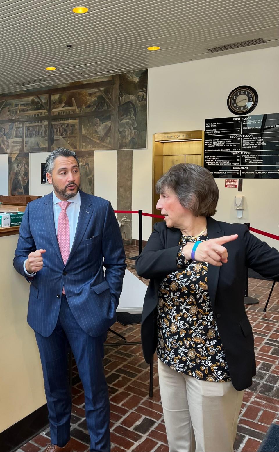 New York Secretary of State Robert J. Rodriguez speaks with Rome Mayor Jacqueline Izzo at City Hall.