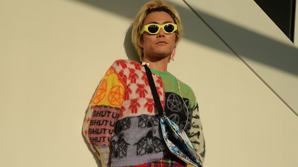 Yu Masui’s colorful outfit combined an Ashley Williams sweater with a Christopher Kane kilt over Dries Van Noten jeans. I change my style every day,” he said, describing his personal style as being like “chameleon.” He added: “Today my theme is punk with ‘90s Harajuku-ness.” - Himari Semans/CNN