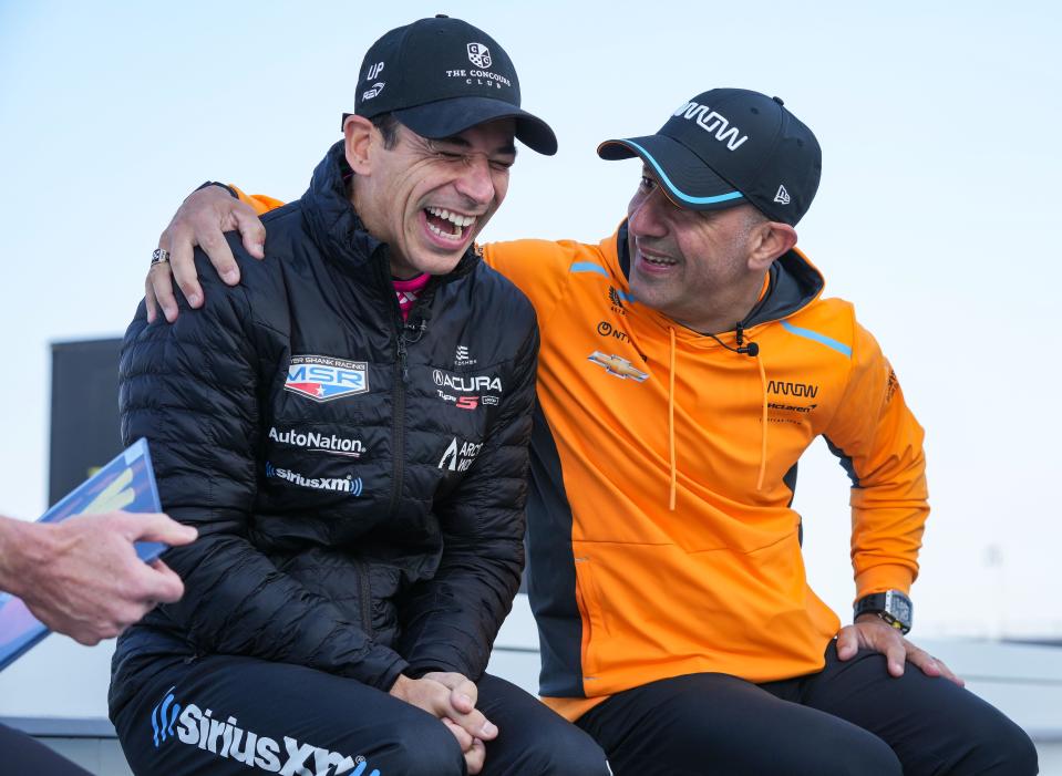 Meyer Shank Racing driver Hélio Castroneves (06) and Arrow McLaren SP driver Tony Kanaan (66) laugh together during an interview Wednesday, May 17, 2023, during the second day of practice for the 107th running of the Indianapolis 500 at Indianapolis Motor Speedway. Kanaan and Castroneves have been friends and racing together for 40 years.