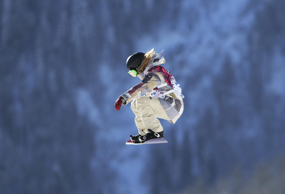 Jamie Anderson of the United States takes a jump during a Snowboard Slopestyle training session at the Rosa Khutor Extreme Park, prior to the 2014 Winter Olympics, Tuesday, Feb. 4, 2014, in Krasnaya Polyana, Russia. (AP Photo/Sergei Grits)