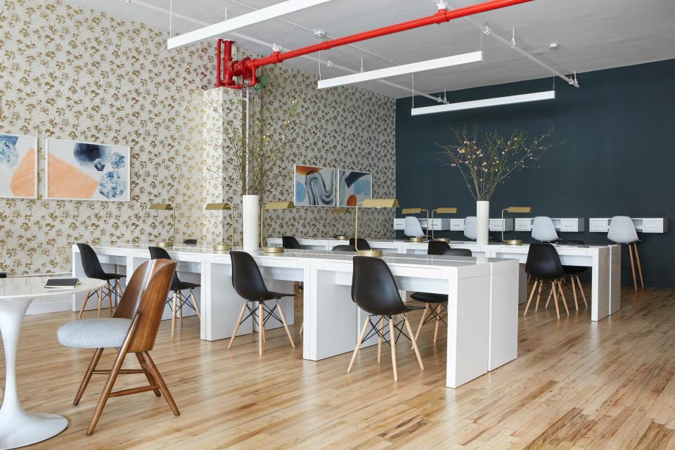 Re-create the communal workspace with sleek desks and shiny lamps from Bed Bath & Beyond. Dining chairs and bar stools, also from BB&B, are a nice alternative to the standard office swivel chair, too.