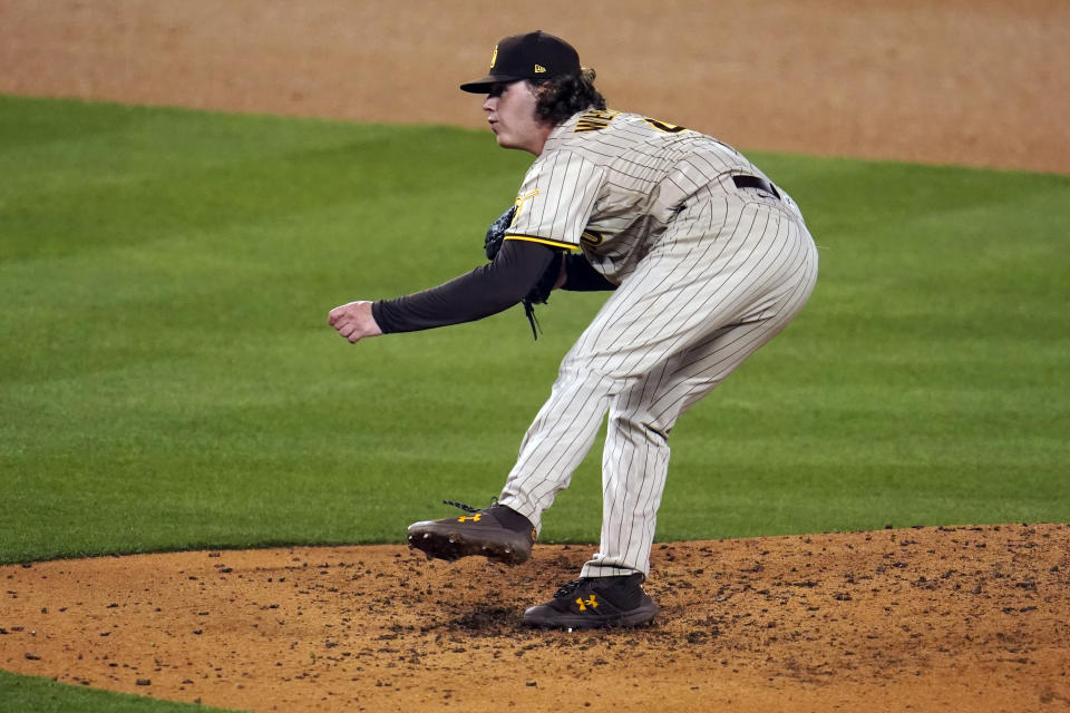 San Diego Padres starting pitcher Ryan Weathers watches a throw to a Los Angeles Dodgers batter during the fifth inning of a baseball game Thursday, April 22, 2021, in Los Angeles. (AP Photo/Marcio Jose Sanchez)