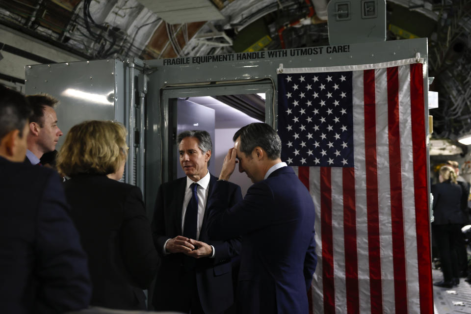 U.S. Secretary of State Antony Blinken, center, talks with Assistant Secretary of State for Near Eastern Affairs Barbara Leaf, second left, Deputy Chief of Staff for Policy Tom Sullivan, left, and Spokesperson Matthew Miller, on board a plane, as he departs for Tel Aviv, during his week-long trip aimed at calming tensions across the Middle East, in Manama, Bahrain, Wednesday, Jan. 10, 2024. (Evelyn Hockstein/Pool Photo via AP)