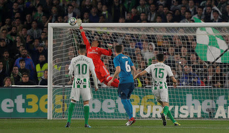 Soccer Football - La Liga Santander - Real Betis vs Real Madrid - Estadio Benito Villamarin, Seville, Spain - February 18, 2018 Real Madrid’s Keylor Navas saves from Real Betis' Joaquin (not pictured) REUTERS/Jon Nazca