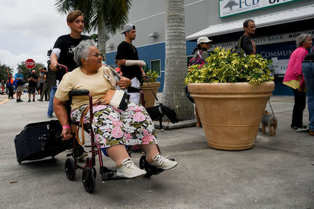 Residents of the surrounding communities arrive at the Germain Arena to seek shelter in preparation for Hurricane Irma in Estero, Florida, U.S., September 9, 2017. REUTERS/Bryan Woolston