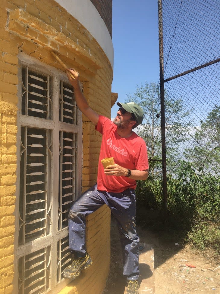 <span class="article__caption">In spring 2022, <em>Backpacker</em> volunteers painted a school. </span> (Photo: Dennis Lewon)