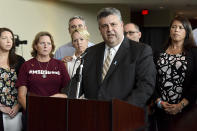 FILE- In this Aug. 9, 2018, file photo, Tony Montalto, father of Gina Rose, a victim of the Marjory Stoneman Douglas High School shooting, speaks during a news conference in Sunrise, Fla. Montalto, whose 14-year-old daughter Gina was killed, is president of "Stand with Parkland," a group composed of parents and spouses of the victims. Despite political differences among the members, the group has been able to stay together and has pushed for enhanced school security measures, better mental health screening programs and universal background checks for gun purchases. (Taimy Alvarez/South Florida Sun-Sentinel via AP, File)