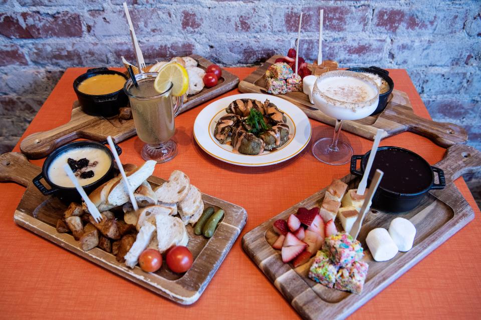 A spread of veggie potstickers and chocolate and cheese fondues at the Melting Pot Social on Patton Ave in Asheville November 24, 2021.