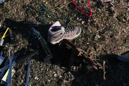 A shoe and other debris sit outside a home destroyed after two deadly back-to-back tornadoes, in Beauregard, Alabama, U.S., March 6, 2019. REUTERS/Shannon Stapleton