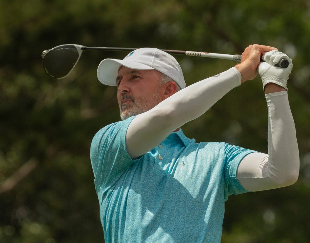 Gary Cona, who won the Championship flight Sunday with partner Brian Armstrong, watches his tee shot on the first hole during the final round of the 57th annual 4-Ball Invitational at Cleveland Heights Golf Course on Sunday, March 26, 2023.