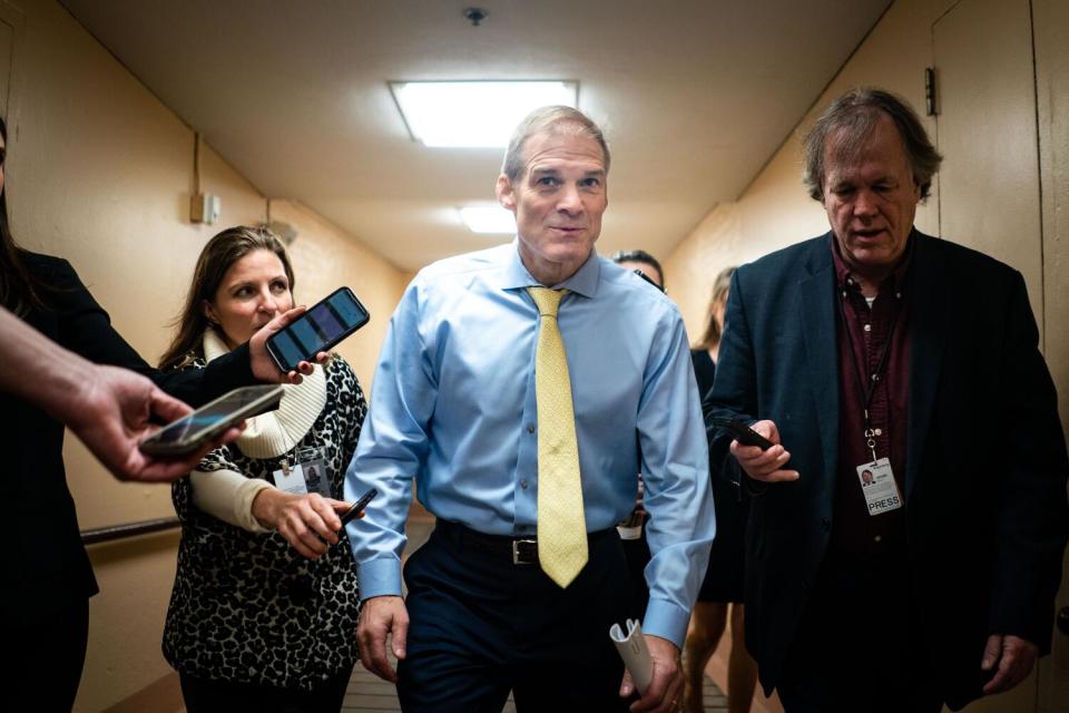 Jim Jordan walks among reporters