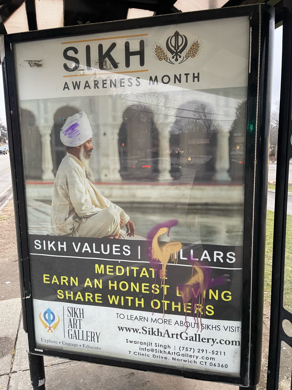 An advertisement placed at a local bus station shows graffiti used to deface the billboard, which was placed by City Council member Swaranjit Singh. Singh told The Bulletin he has long placed the advertisements and other bus stations around the city remained untouched but wondered if his recent election to city council made him a target.