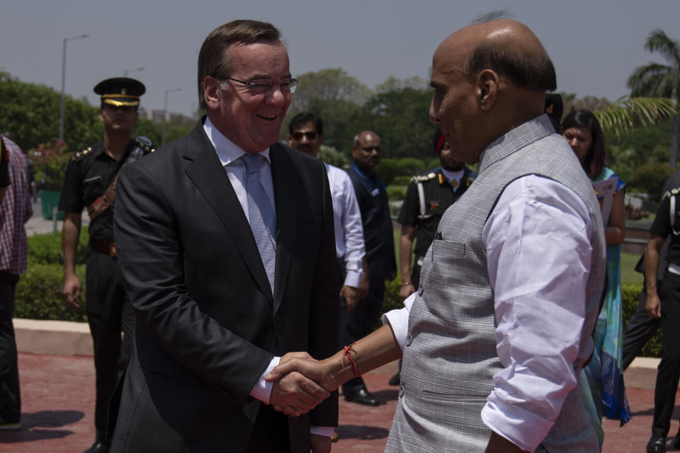 Indian Defense Minister Rajnath Singh welcomes German Defense Minister Boris Pistorius in New Delhi, India, Tuesday, June 6, 2023. (AP Photo/Altaf Qadri)