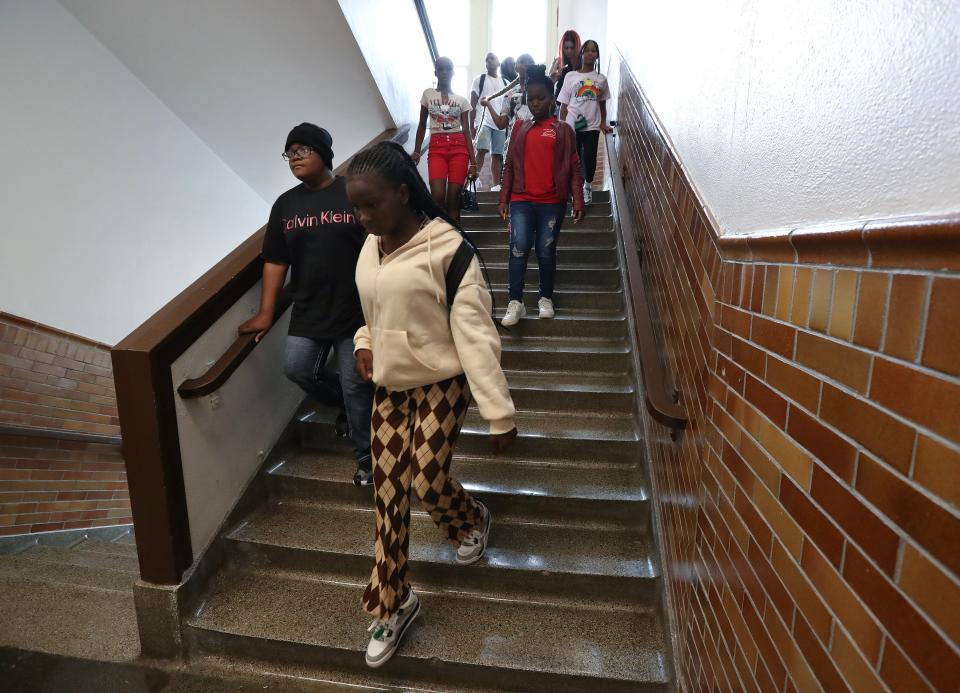 Students descend a stairwell as they head to lunch on the first day of school at The Academy @ Shawnee in Louisville, Ky. on Aug. 9, 2023.  Enrollment has increased by 400 students this year.