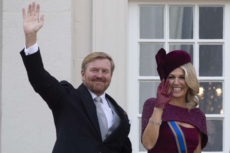FILE - In this Tuesday, Sept. 17, 2019 file photo, Dutch King Willem-Alexander and Queen Maxima wave from the balcony of royal palace Noordeinde in The Hague, Netherlands. The Dutch king issued a video message Wednesday saying "with sorrow in the heart" that he regrets flying to Greece for a family vacation last week, a trip that was quickly broken off amid public uproar back home where people are being urged to stay home as much as possible to battle the coronavirus. (AP Photo/Peter Dejong, File)