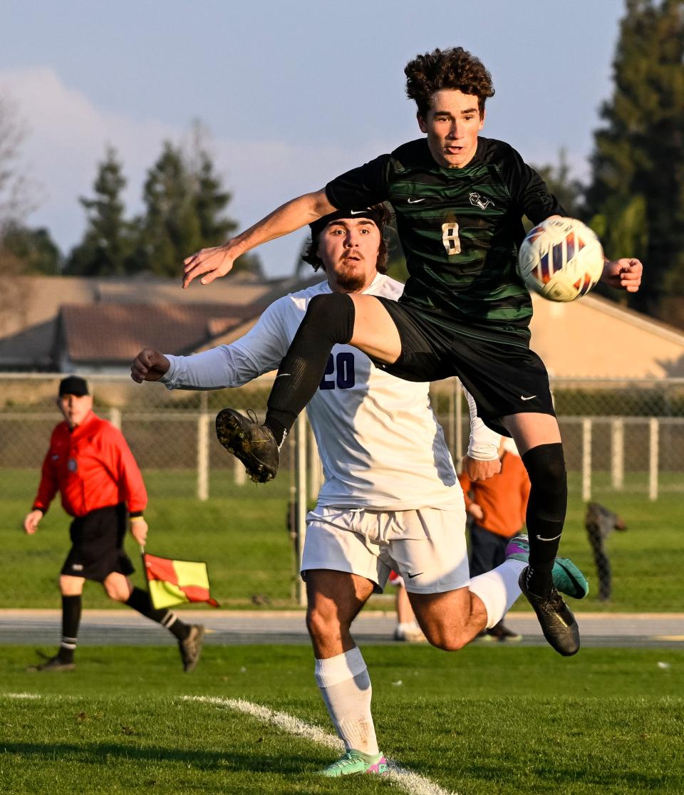 El Diamante's Beckham Ybarra leaps in front of Lemoore's Keaton Frye in a non-league boys soccer game on Thursday, January 4, 2024.